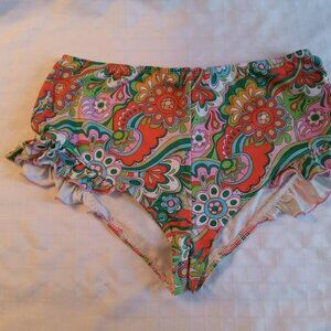 Very short, stretchy shorts with a vibrant hippie pattern